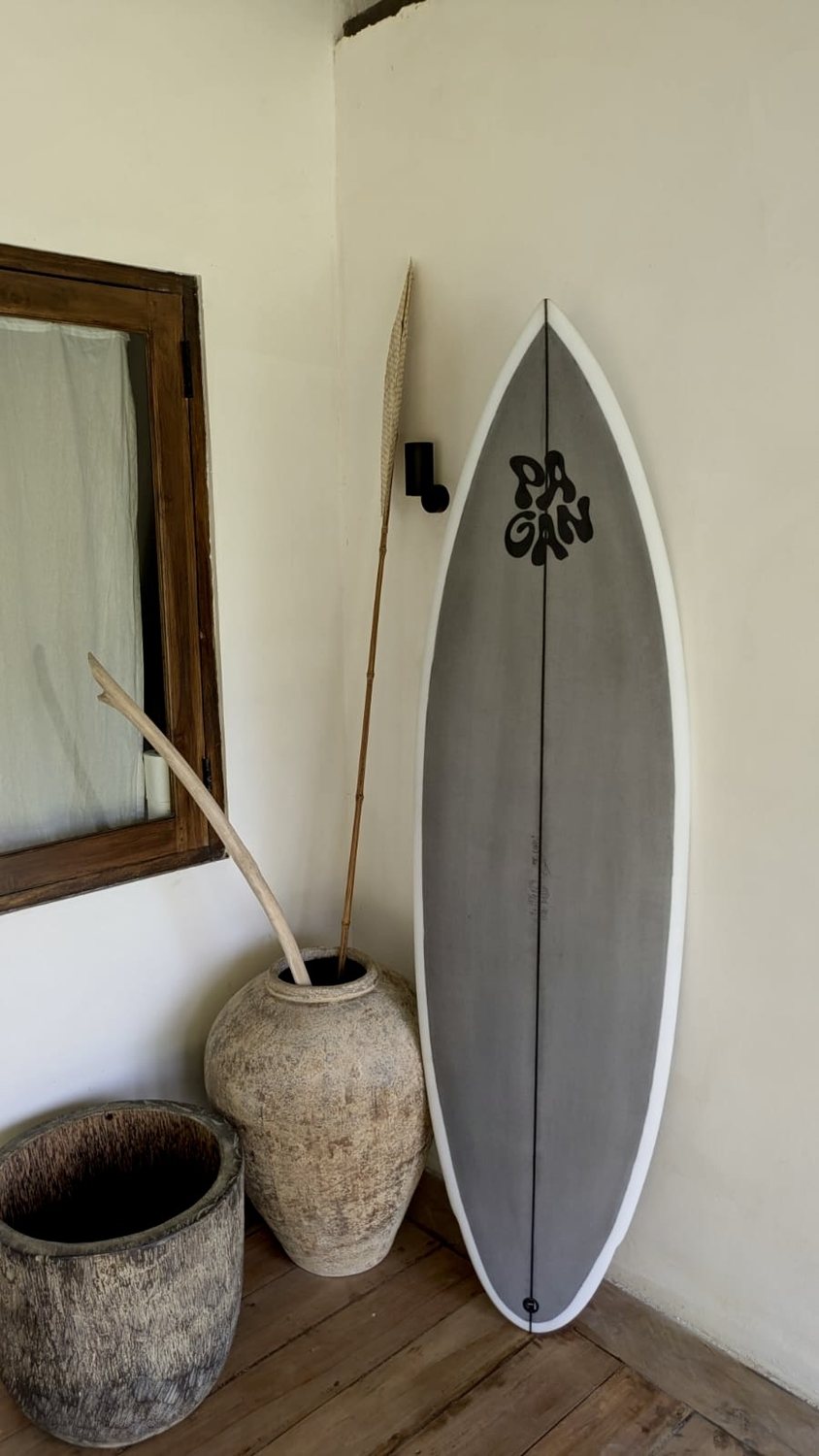 Grey board indoors beside a mirror