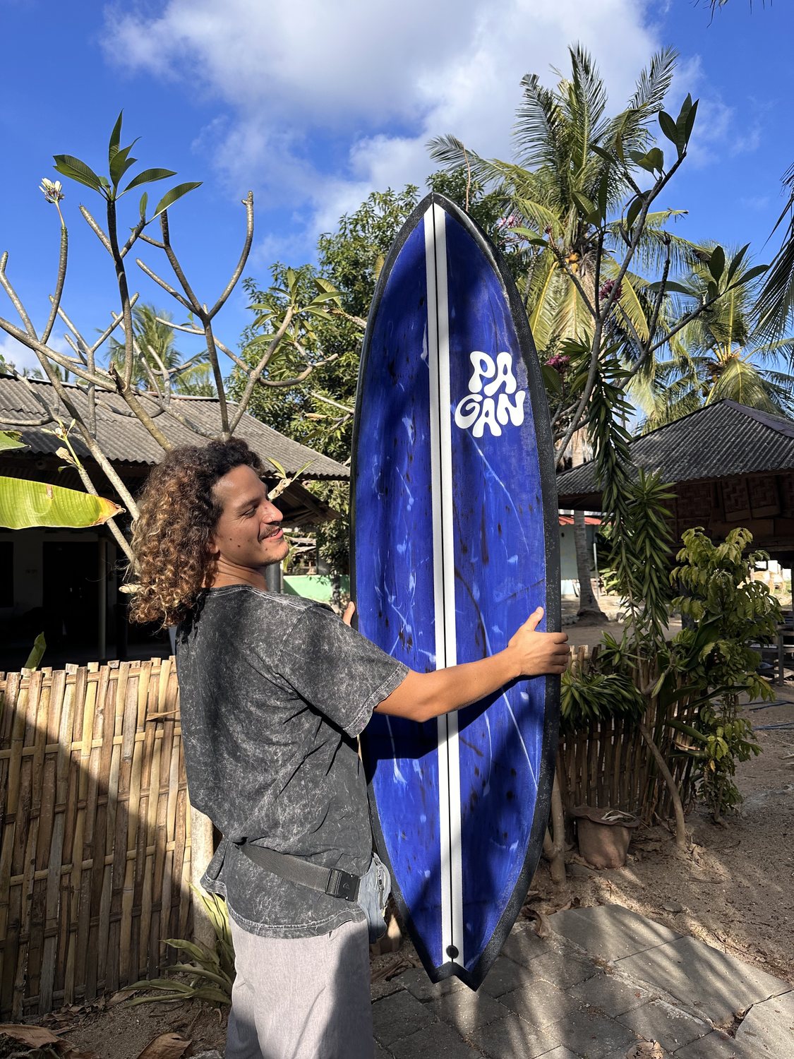 Franco holding up the blue swirl board